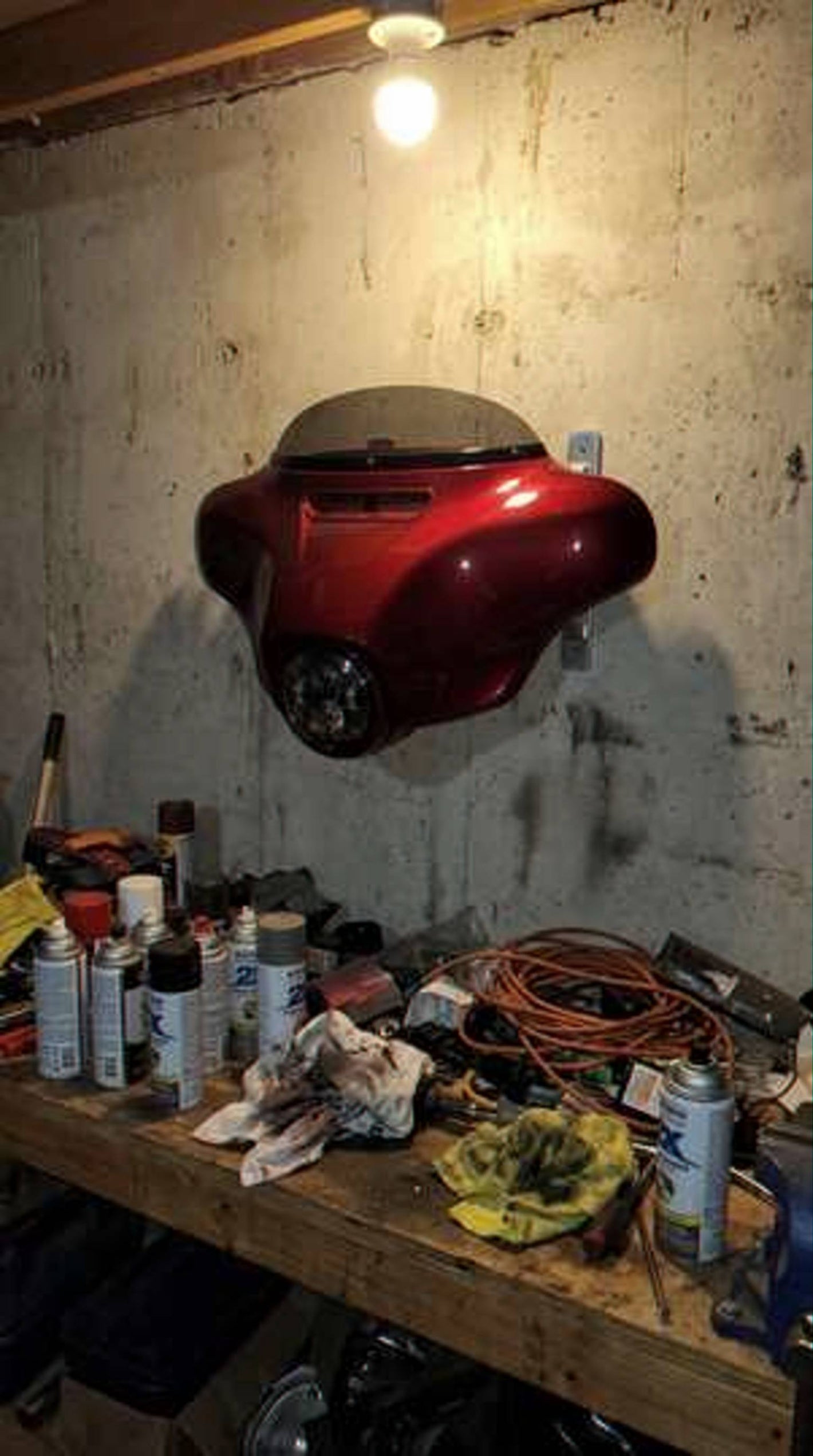 Customer photo - red HarleyHood above workbench